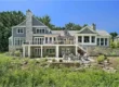 Picture of a large gray exterior showing what makes a vacation home luxury-grade